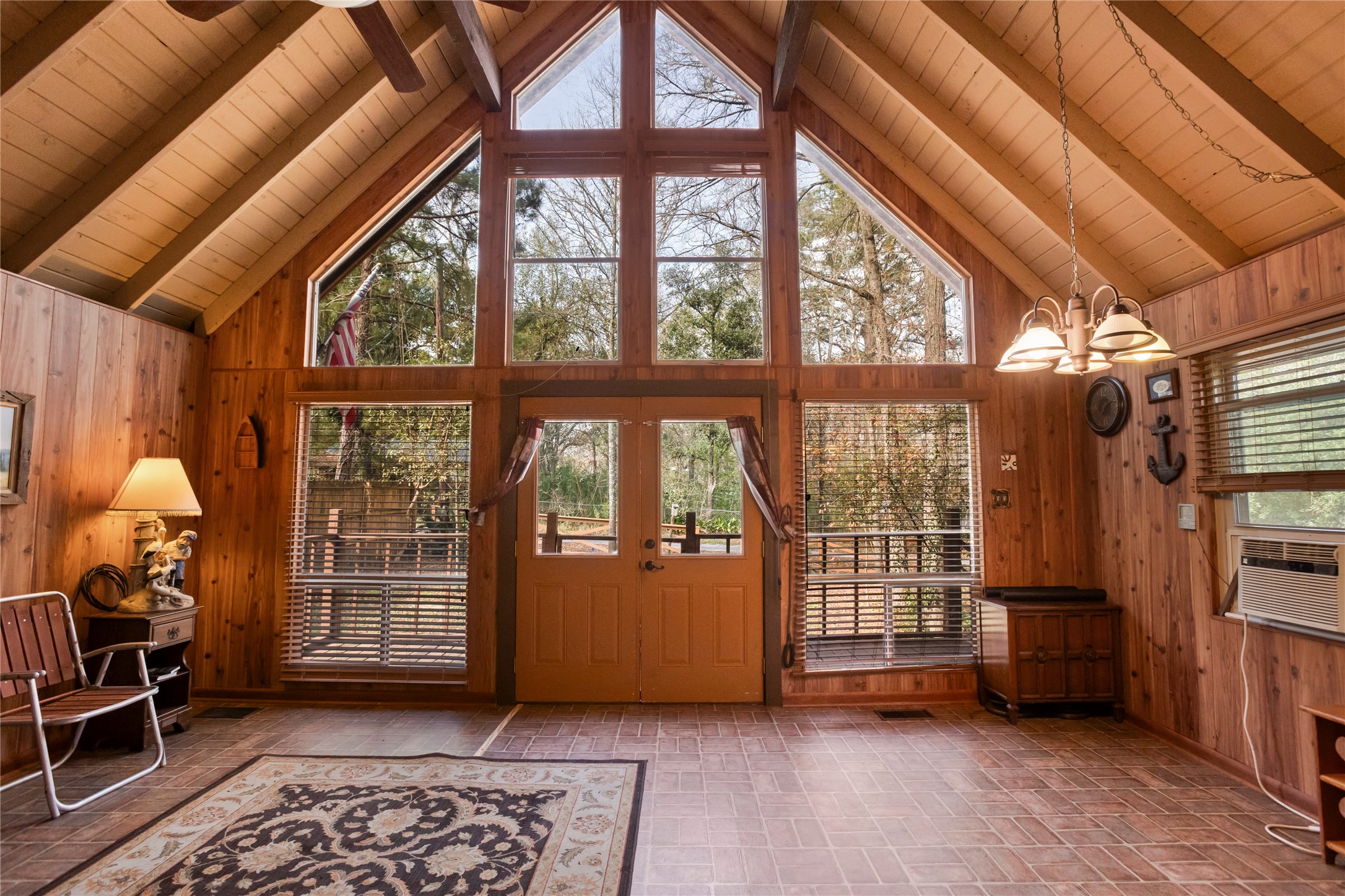 20 Shannon Street Huntsville, TX 77320 - Photo 7 of 29 a view of an empty room with a window and brick wall