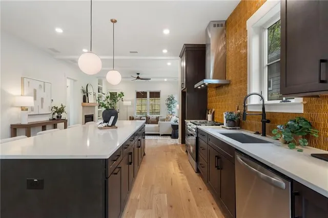 a large kitchen with a table and chairs