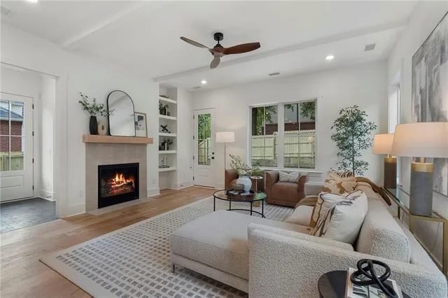 a living room with furniture and a fireplace