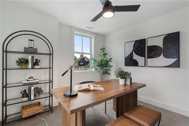 a view of a patio with a dining table and chairs