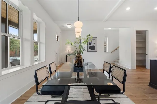 a workspace filed with furniture window and wooden floor
