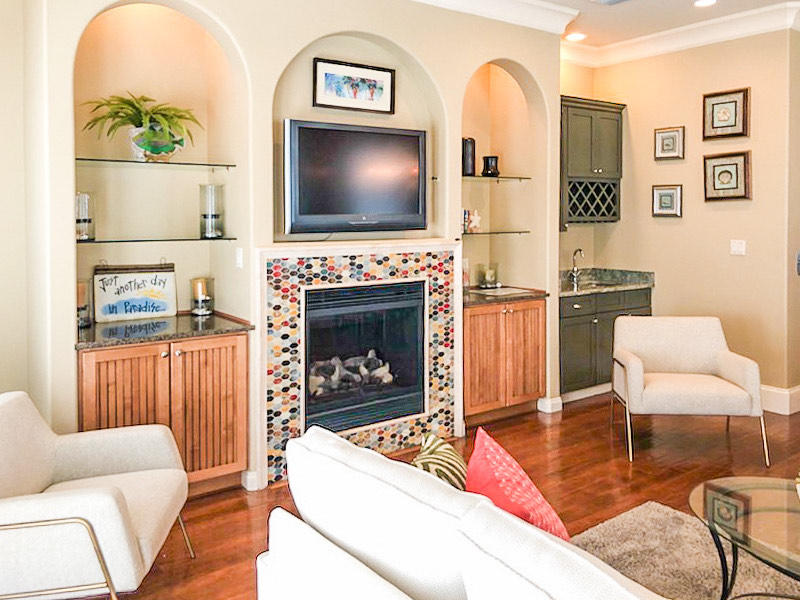 4836 Ocean Boulevard Destin, FL 32541 - Photo 11 of 71 a living room with furniture a flat screen tv and a fireplace