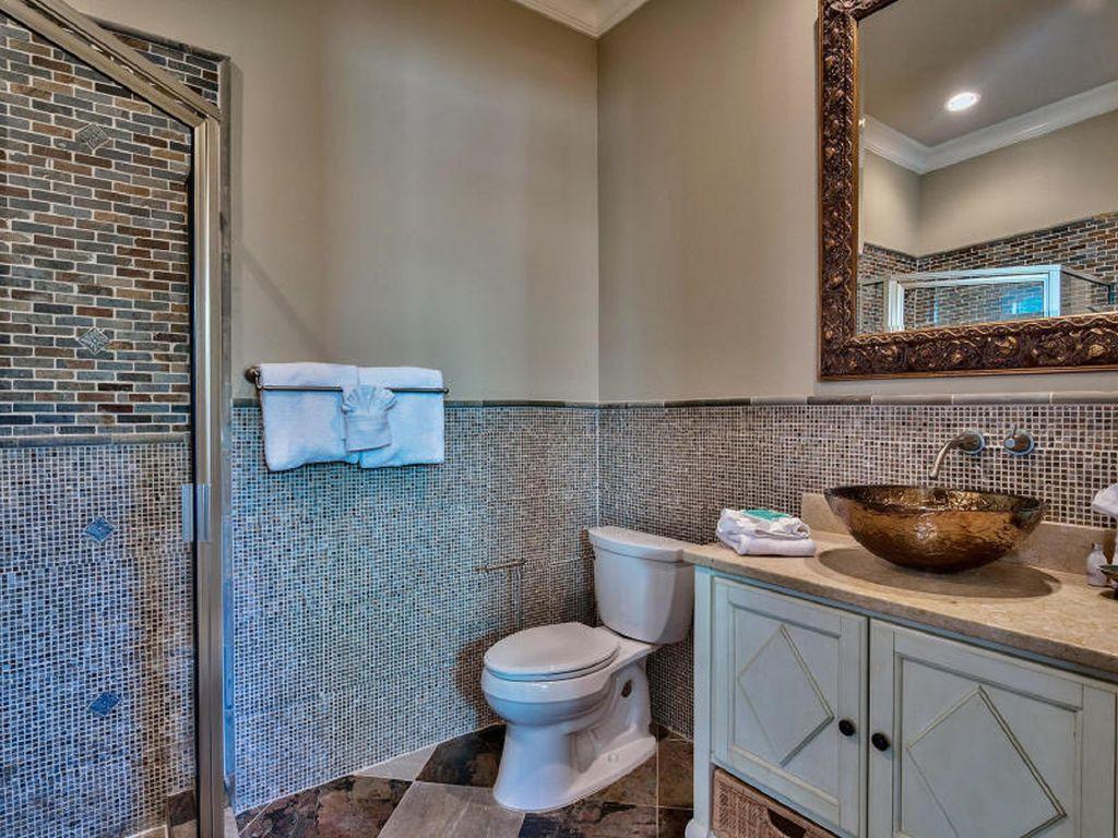 4836 Ocean Boulevard Destin, FL 32541 - Photo 26 of 71 a bathroom with a toilet and a sink