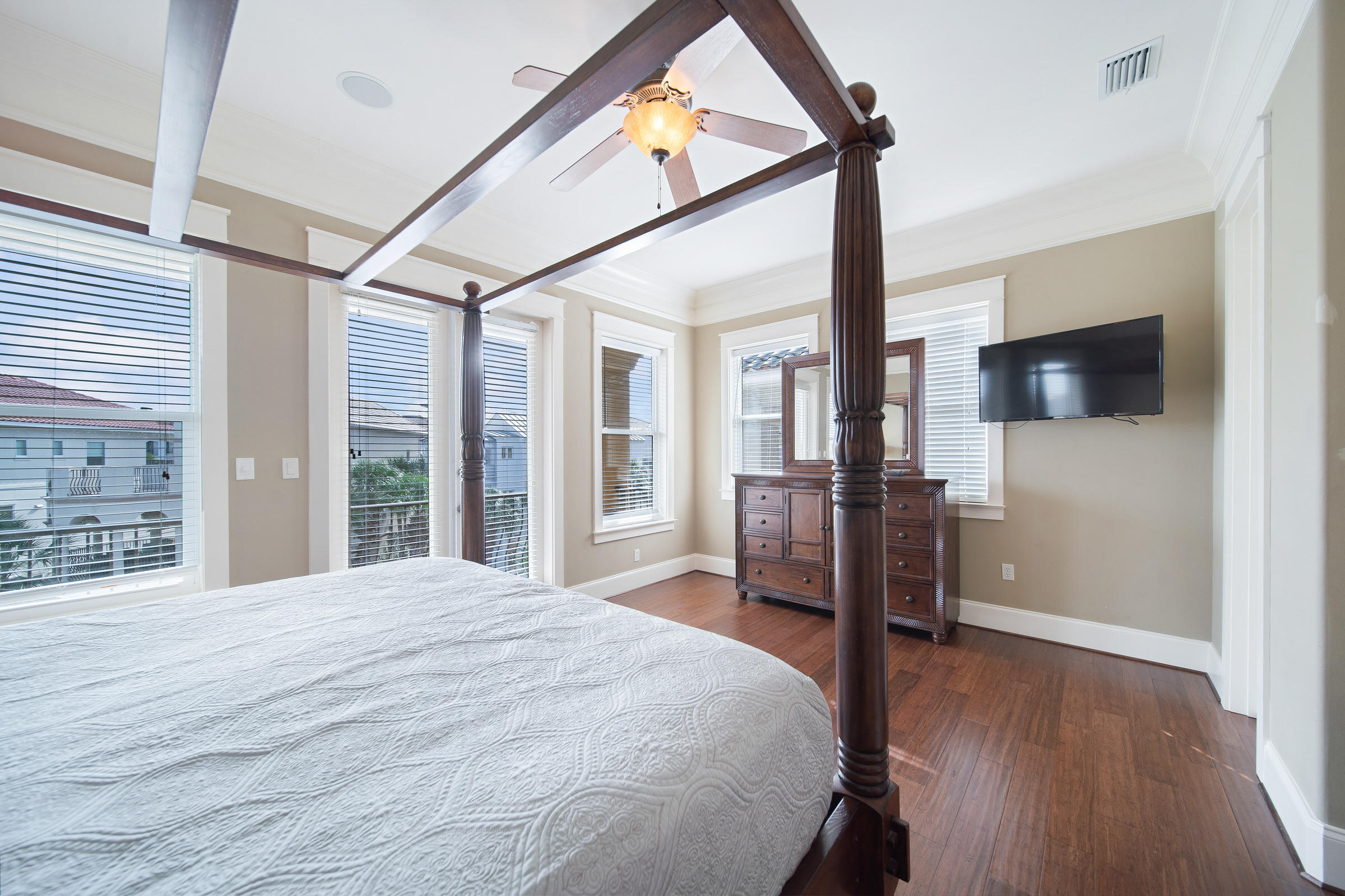 4836 Ocean Boulevard Destin, FL 32541 - Photo 29 of 71 a bedroom with a bed and a flat screen tv