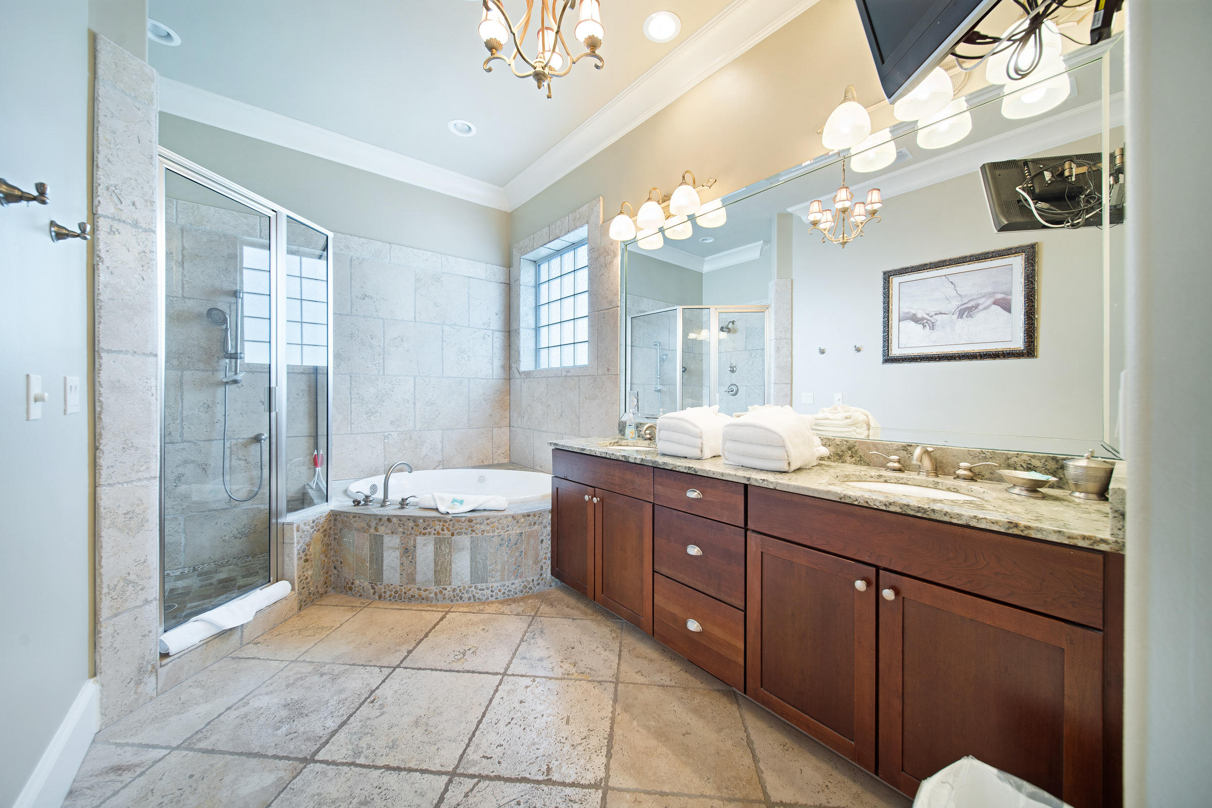 4836 Ocean Boulevard Destin, FL 32541 - Photo 31 of 71 a spacious bathroom with a granite countertop sink a toilet a mirror and shower