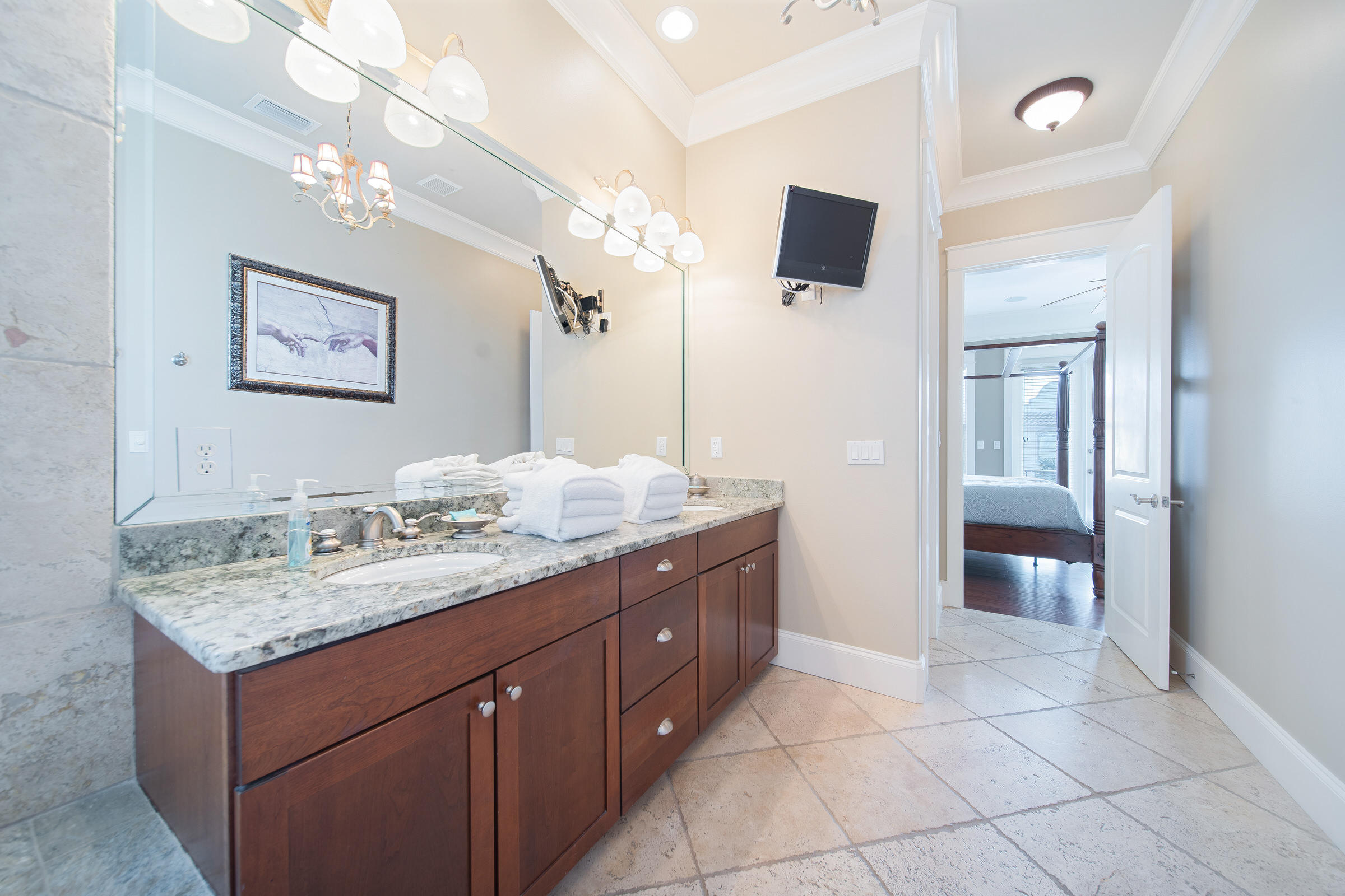 4836 Ocean Boulevard Destin, FL 32541 - Photo 33 of 71 a bathroom with a granite countertop sink a mirror and vanity