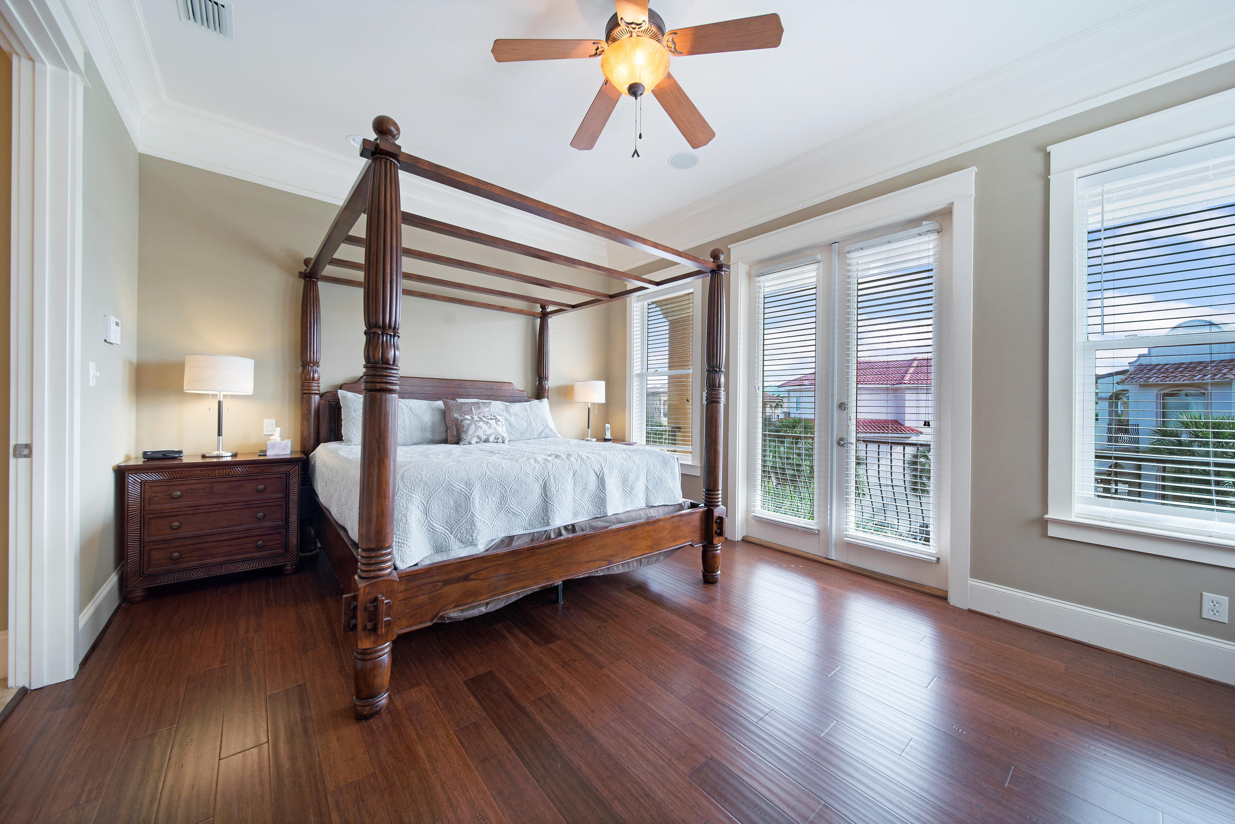 4836 Ocean Boulevard Destin, FL 32541 - Photo 36 of 71 a bedroom with a bed and wooden floor
