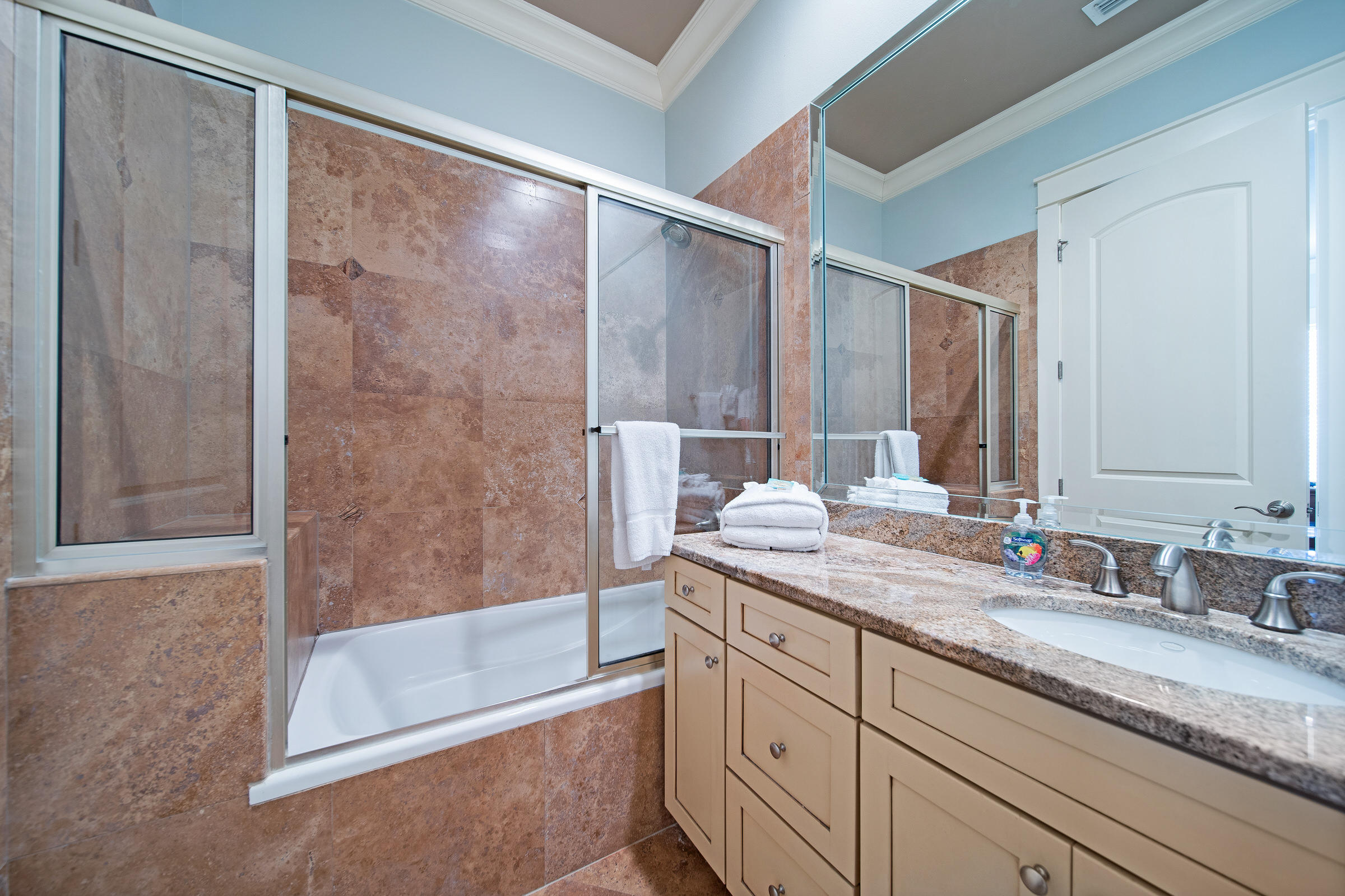 4836 Ocean Boulevard Destin, FL 32541 - Photo 38 of 71 a bathroom with a granite countertop sink mirror and a bathtub
