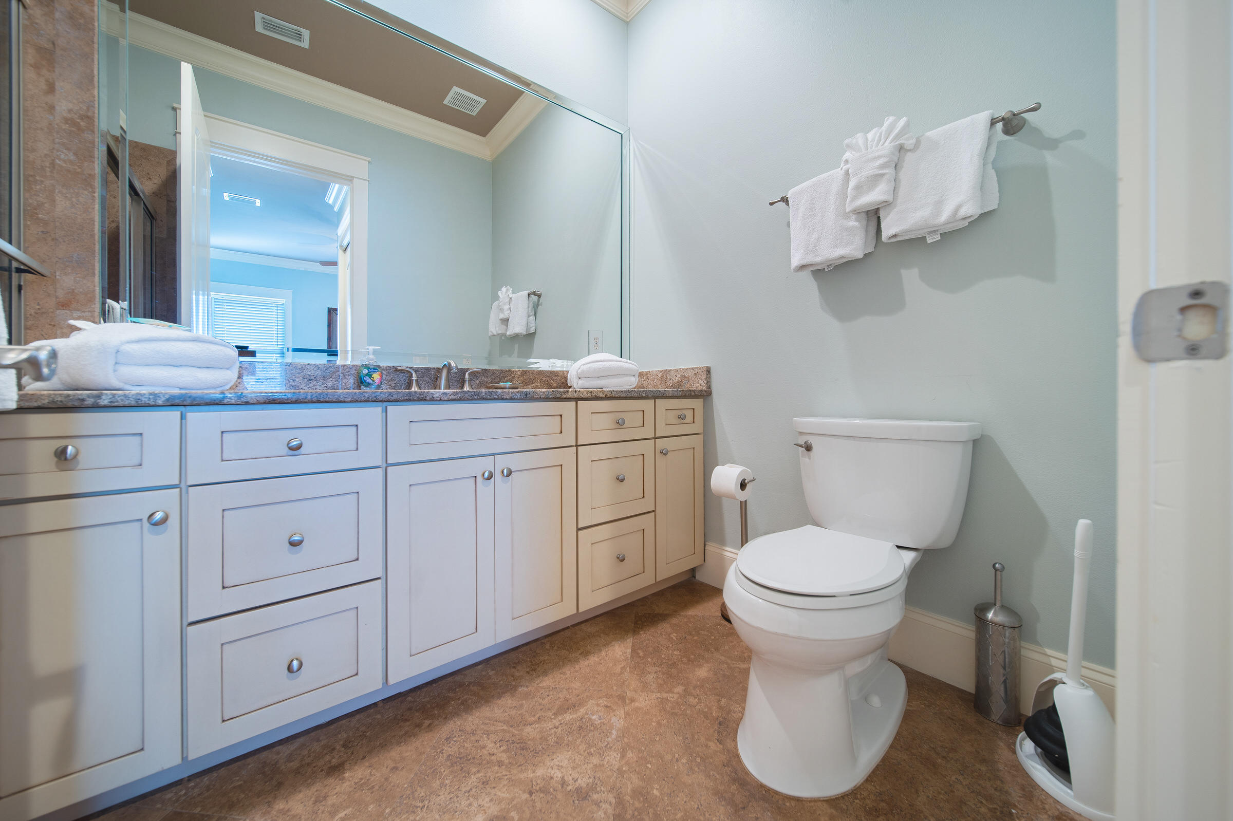 4836 Ocean Boulevard Destin, FL 32541 - Photo 39 of 71 a bathroom with a toilet sink and mirror