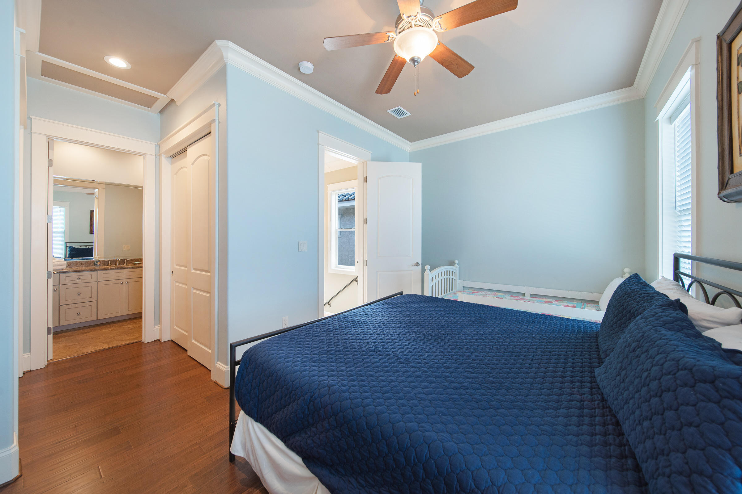 4836 Ocean Boulevard Destin, FL 32541 - Photo 40 of 71 a bedroom with a bed and a chandelier