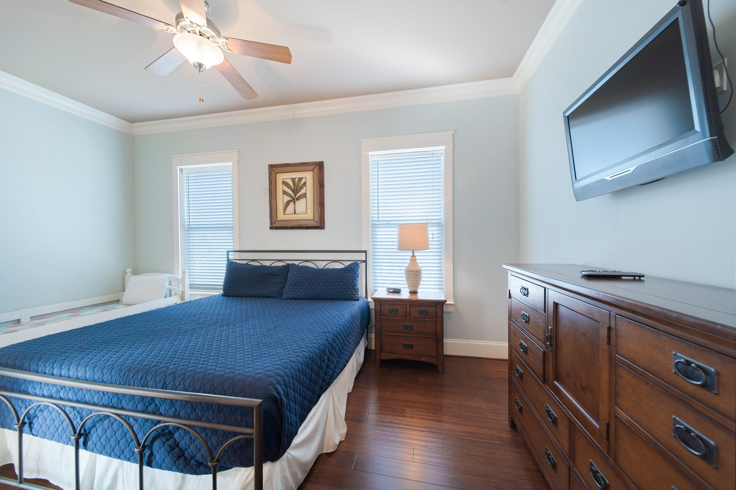4836 Ocean Boulevard Destin, FL 32541 - Photo 41 of 71 a bedroom with a bed and a tv on the dresser