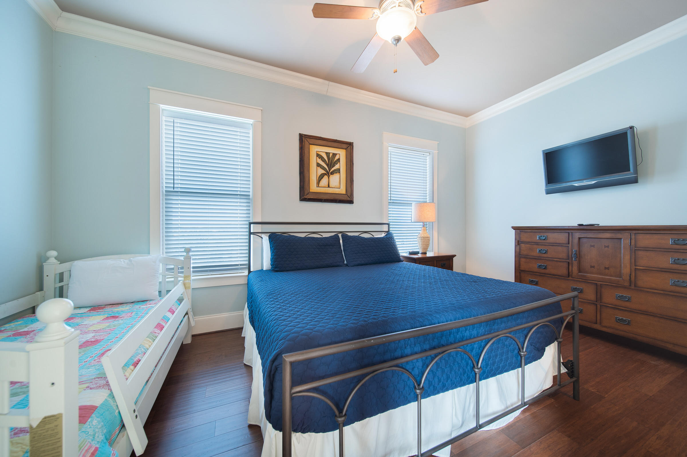 4836 Ocean Boulevard Destin, FL 32541 - Photo 42 of 71 a bedroom with a bed and a tv on the dresser