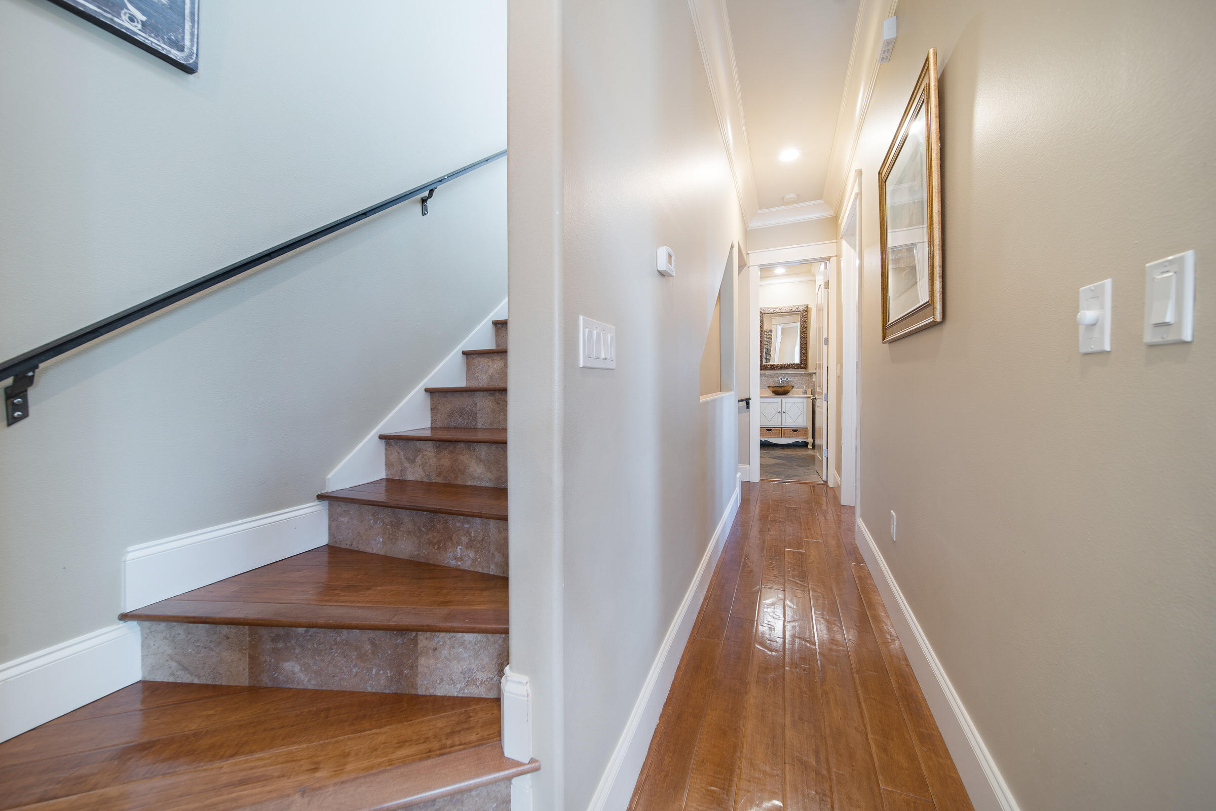 4836 Ocean Boulevard Destin, FL 32541 - Photo 44 of 71 a view of a hallway with wooden floor and staircase