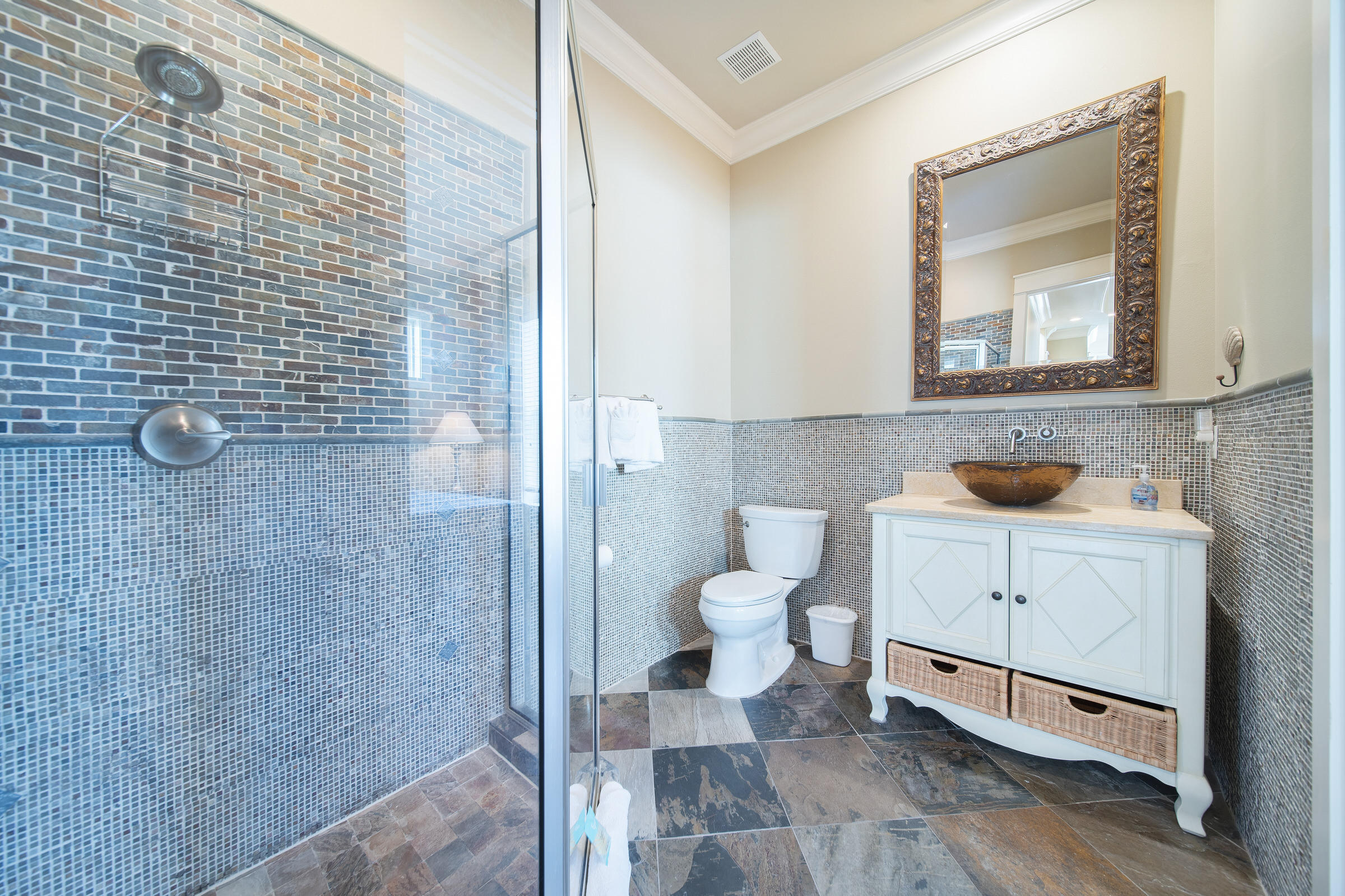4836 Ocean Boulevard Destin, FL 32541 - Photo 47 of 71 a bathroom with a toilet a sink and mirror