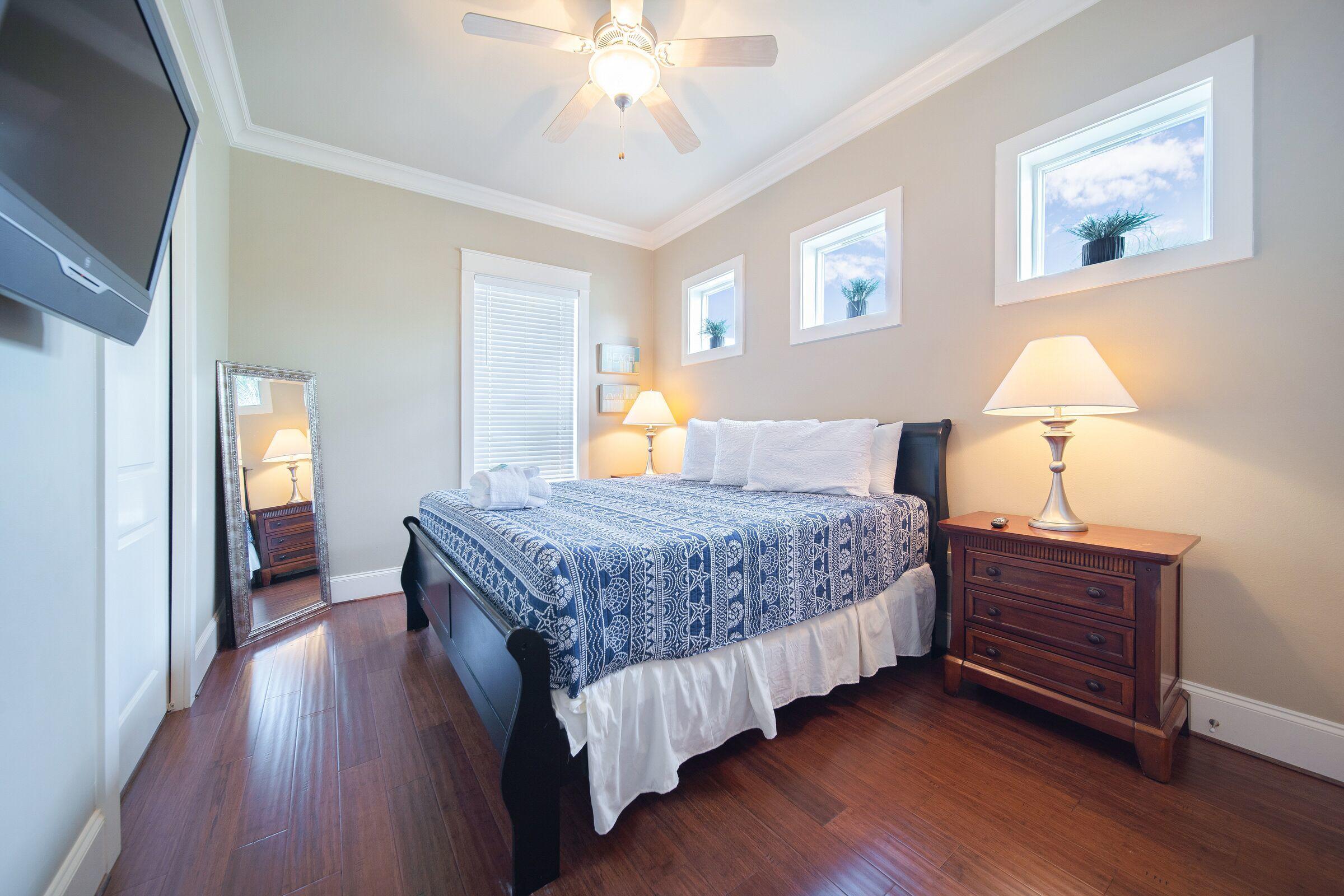 4836 Ocean Boulevard Destin, FL 32541 - Photo 50 of 71 a bedroom with bed and wooden floor