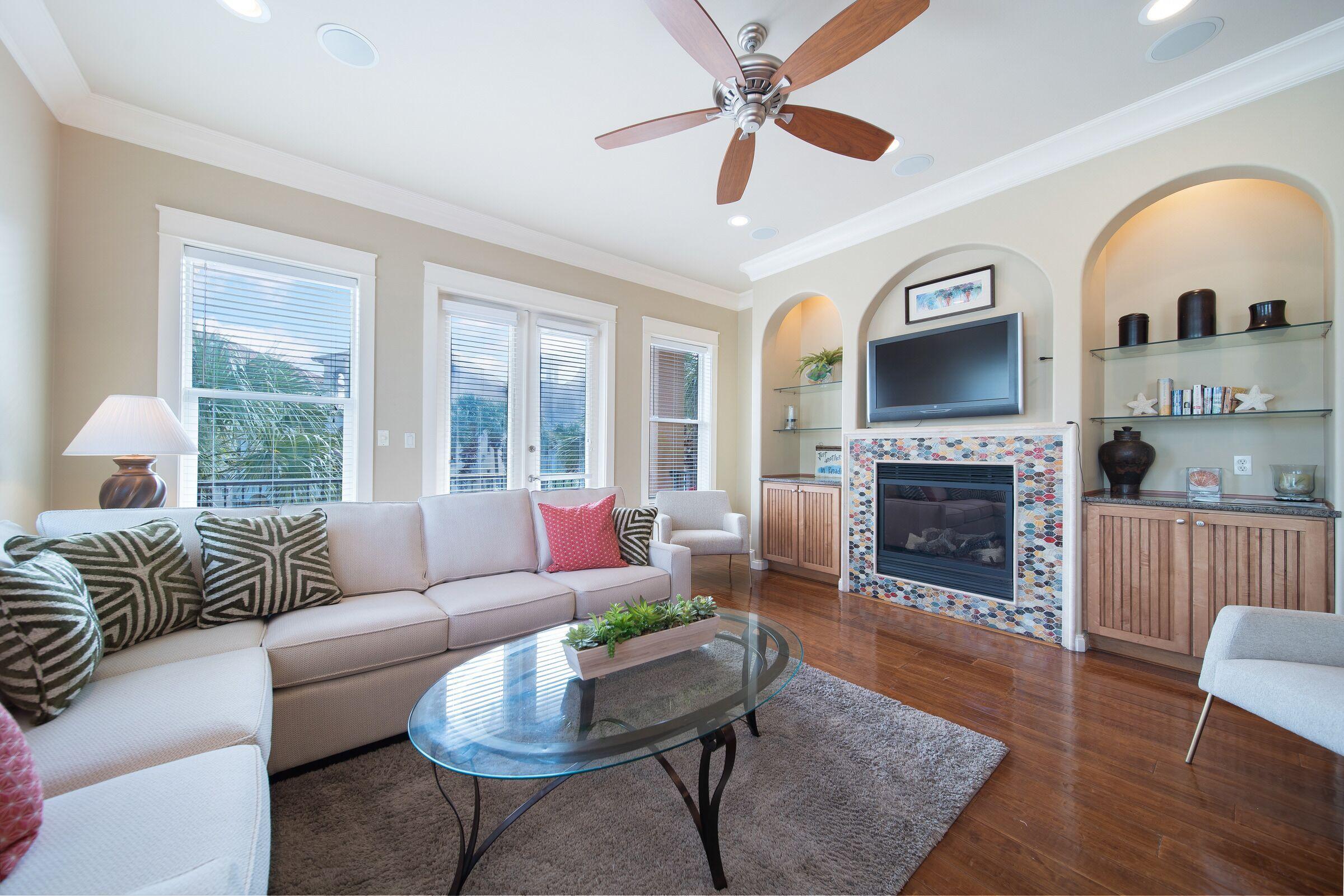 4836 Ocean Boulevard Destin, FL 32541 - Photo 5 of 71 a living room with furniture fireplace and a large window