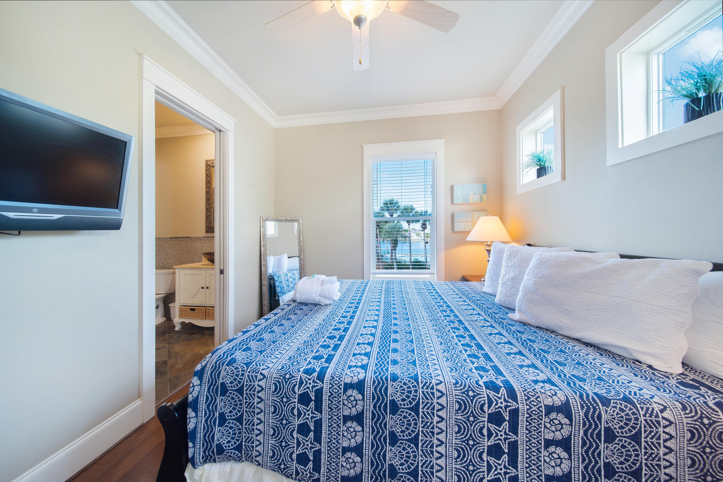 4836 Ocean Boulevard Destin, FL 32541 - Photo 53 of 71 a bedroom with a large bed and a flat screen tv