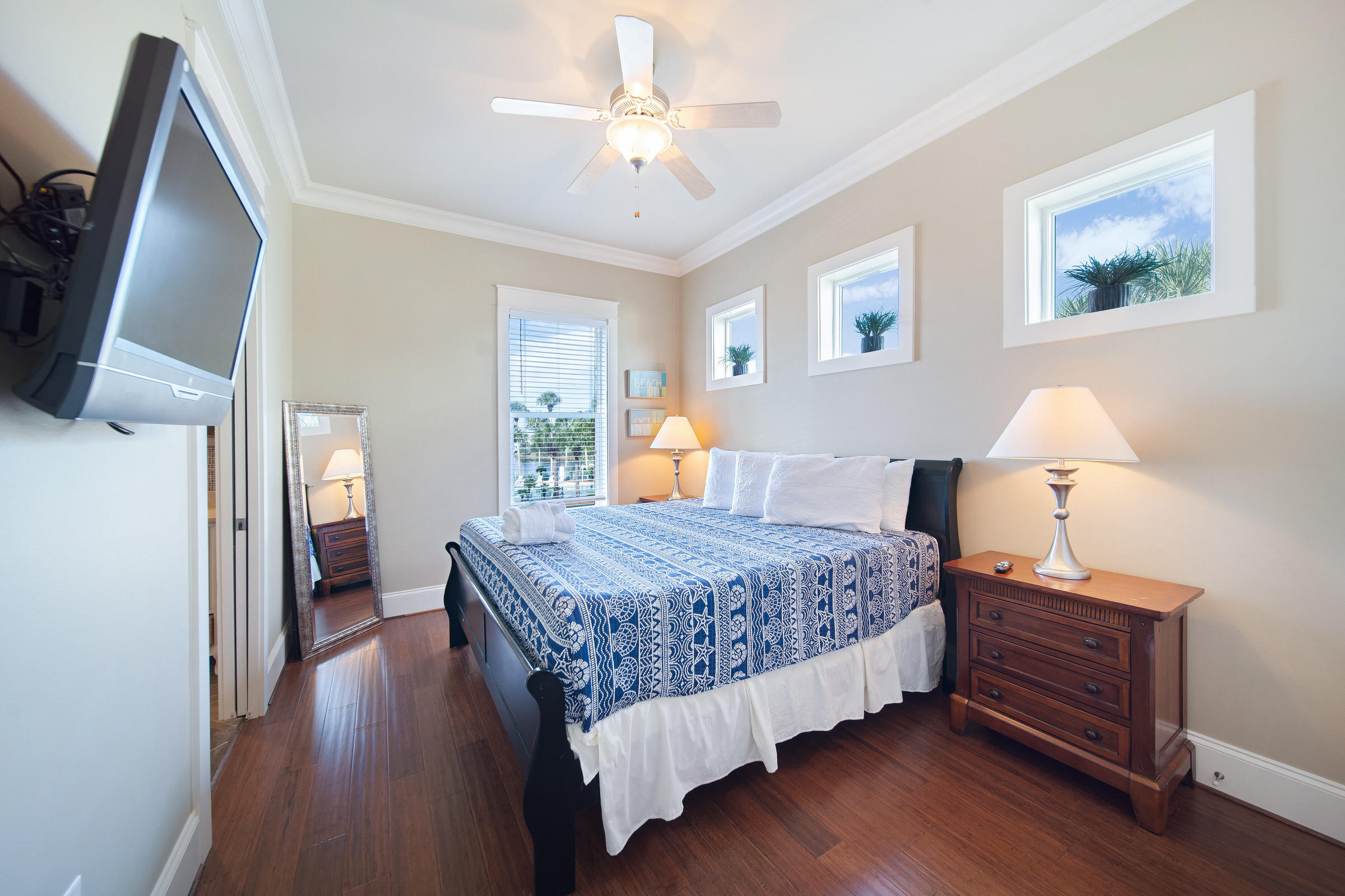 4836 Ocean Boulevard Destin, FL 32541 - Photo 54 of 71 a bedroom with a bed and wooden floor