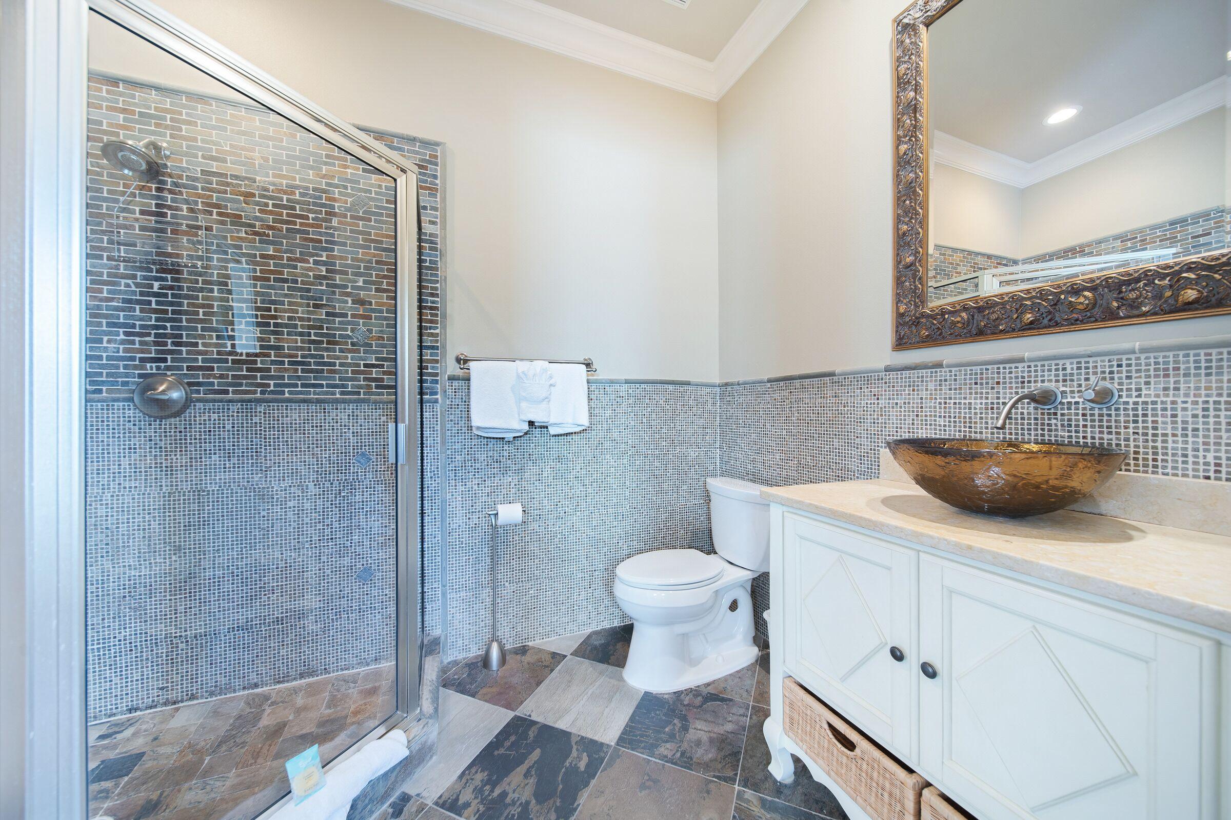 4836 Ocean Boulevard Destin, FL 32541 - Photo 58 of 71 a bathroom with a sink a toilet and shower