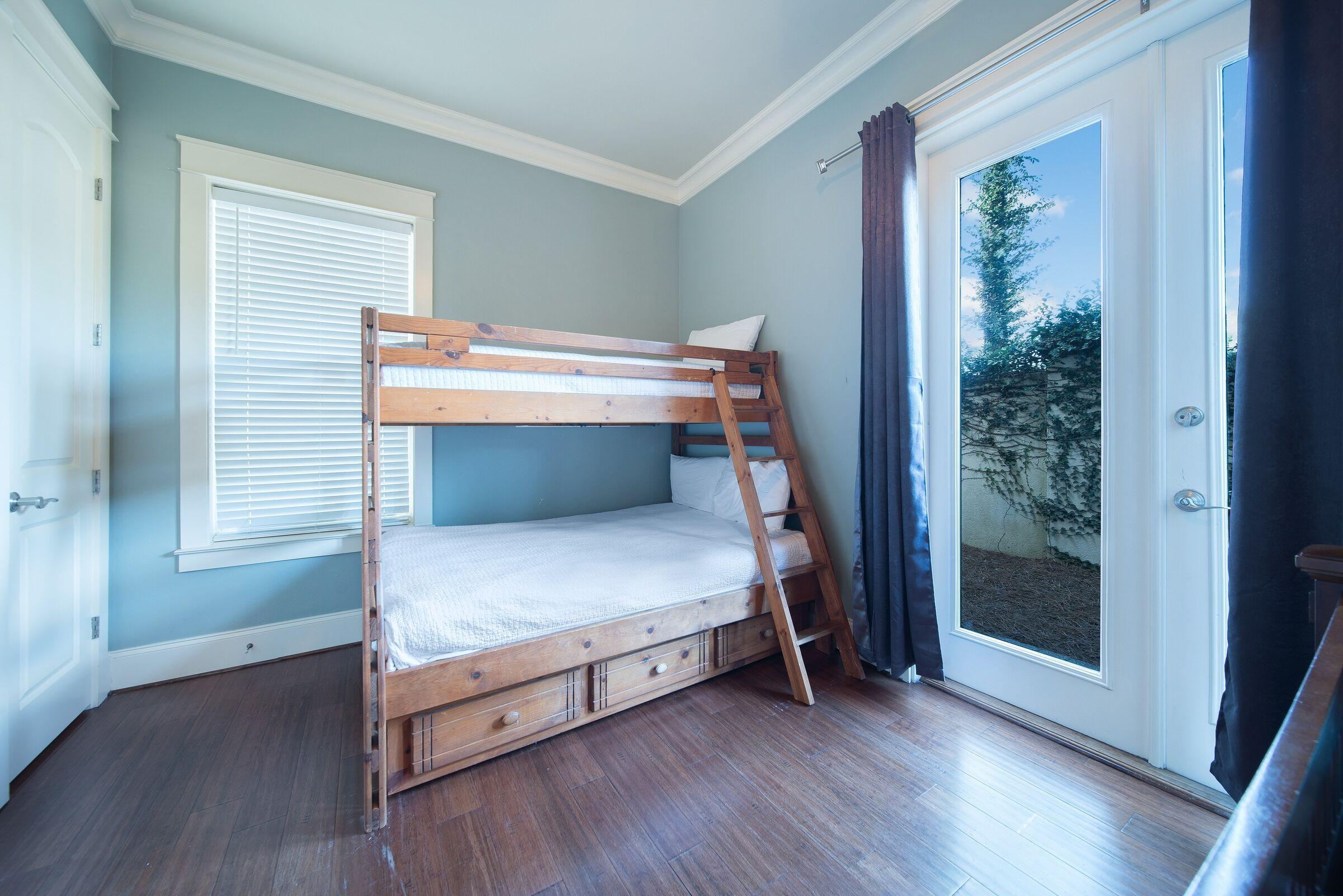 4836 Ocean Boulevard Destin, FL 32541 - Photo 60 of 71 a bedroom with wooden floor and window