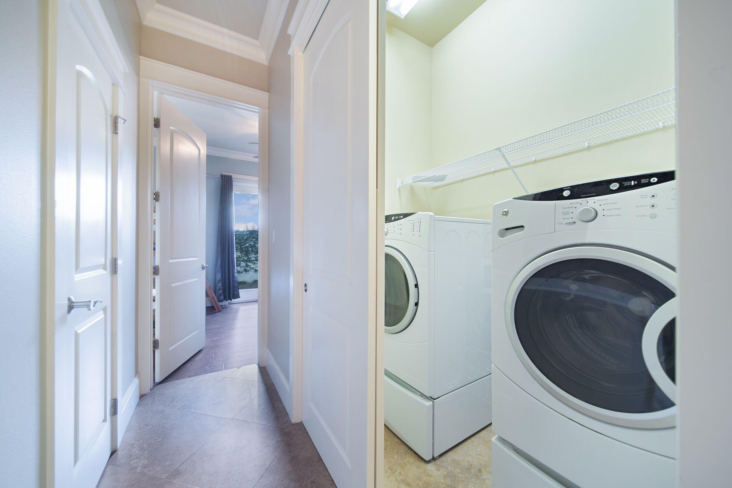 4836 Ocean Boulevard Destin, FL 32541 - Photo 62 of 71 a view of a hallway with washer and dryer