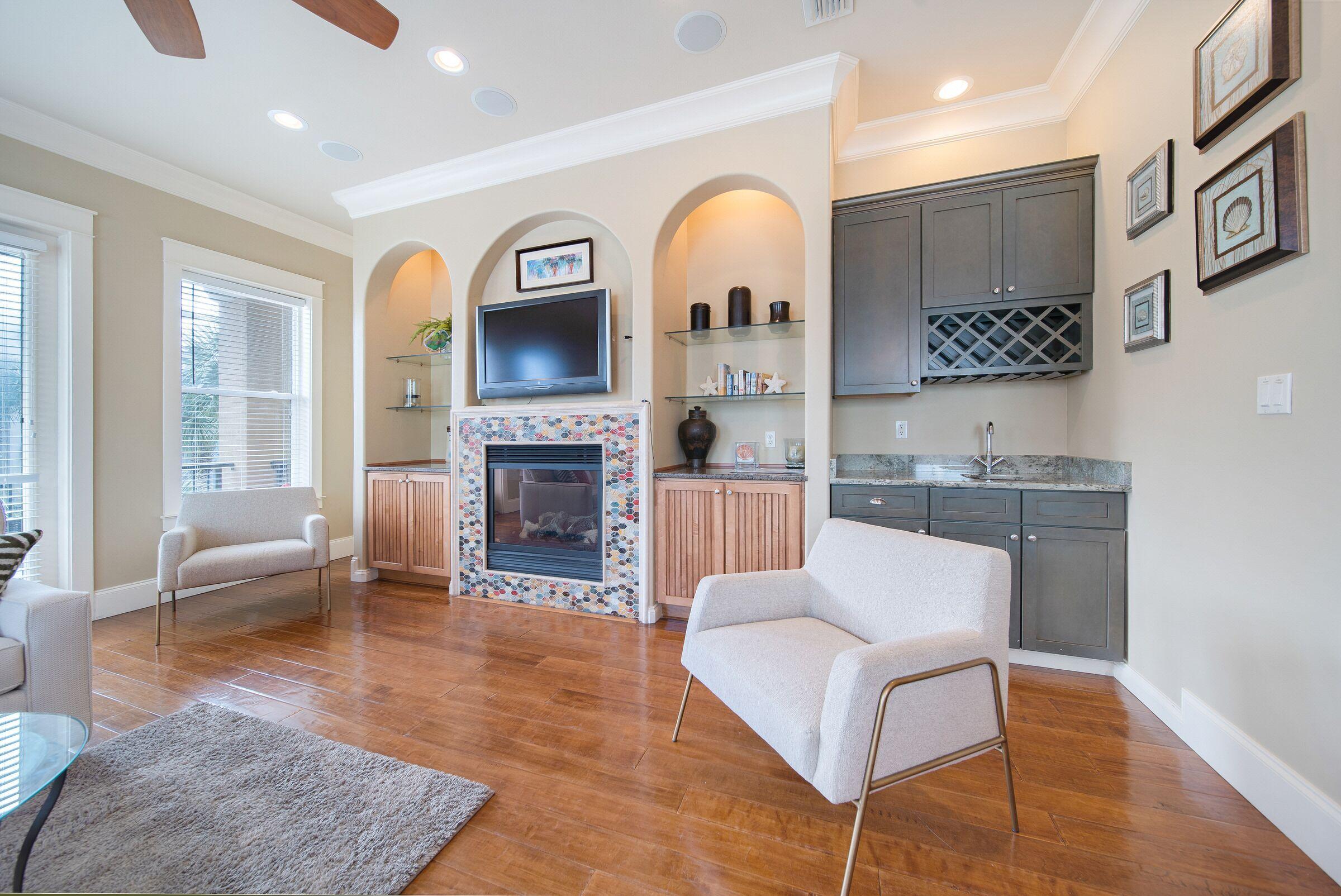 4836 Ocean Boulevard Destin, FL 32541 - Photo 8 of 71 a living room with furniture and a fireplace