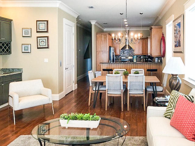4836 Ocean Boulevard Destin, FL 32541 - Photo 10 of 71 a dining room with furniture a large window and a chandelier