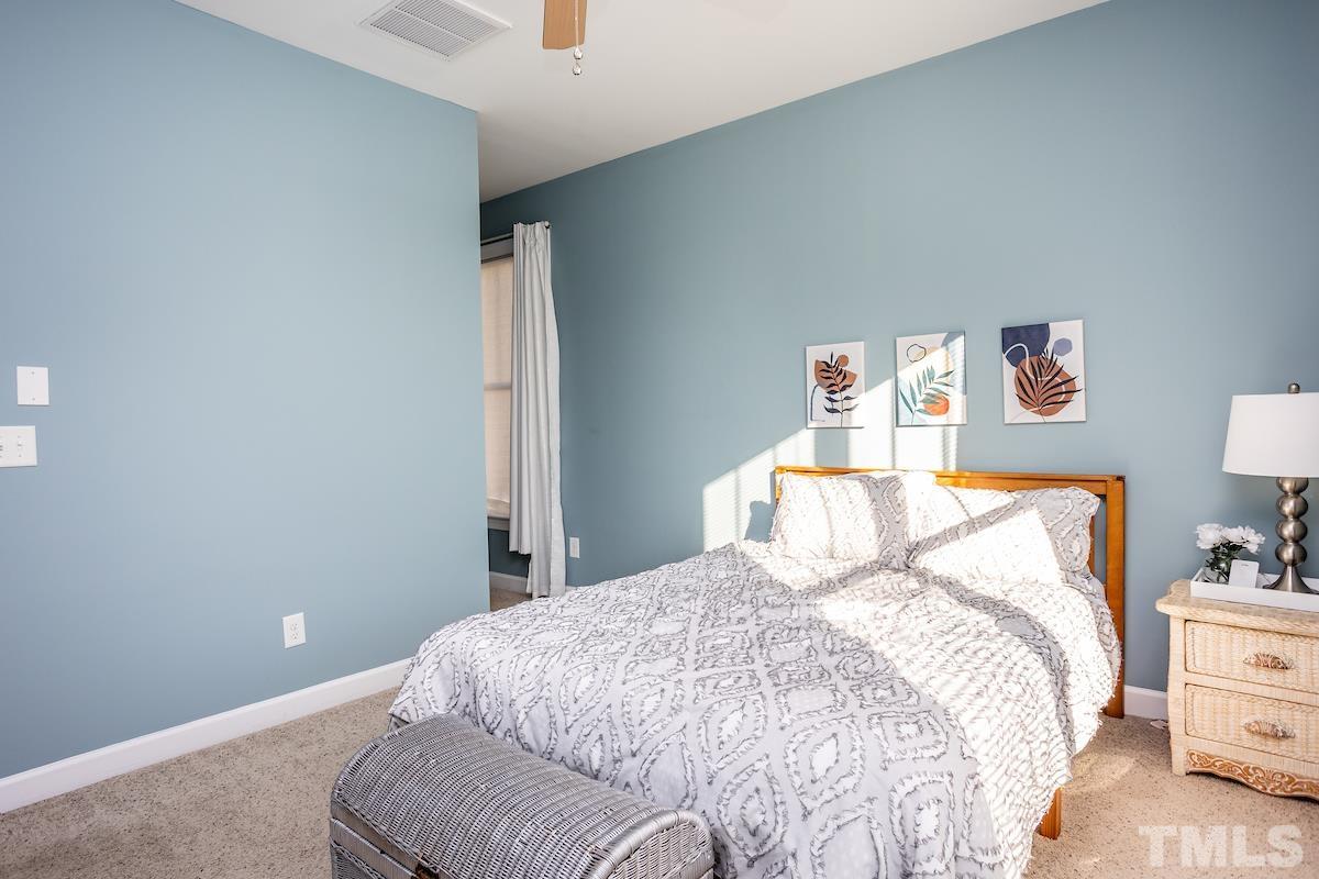 805 East Jones Street Raleigh, NC 27601 - Photo 14 of 24 a bedroom with a bed and dresser