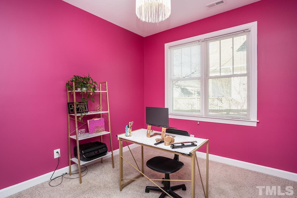805 East Jones Street Raleigh, NC 27601 - Photo 17 of 24 a view of a workspace with furniture