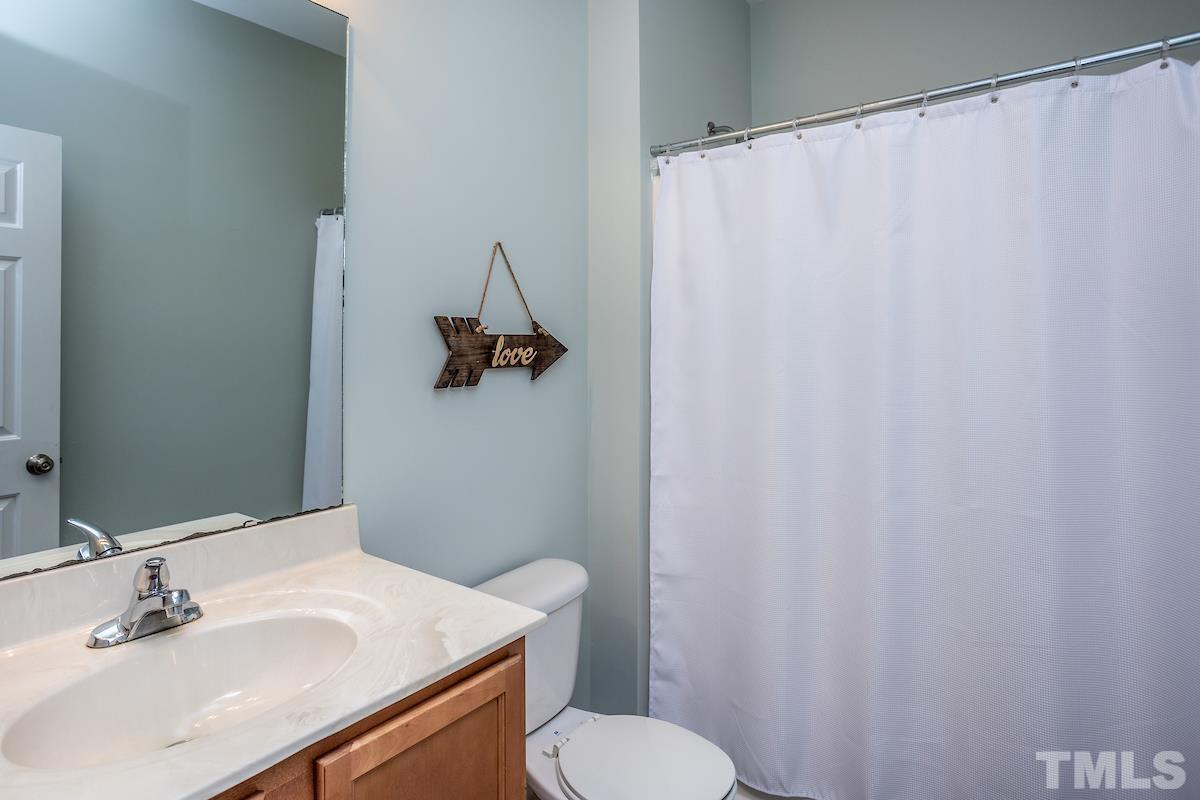 805 East Jones Street Raleigh, NC 27601 - Photo 18 of 24 a bathroom with a sink and a toilet