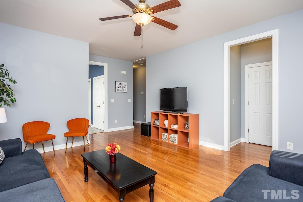 805 East Jones Street Raleigh, NC 27601 - Photo 5 of 24 a living room with furniture and wooden floor