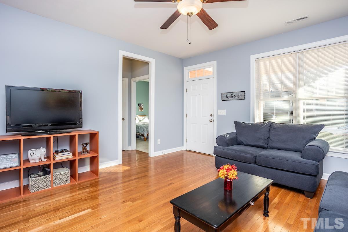 805 East Jones Street Raleigh, NC 27601 - Photo 6 of 24 a living room with furniture and a flat screen tv