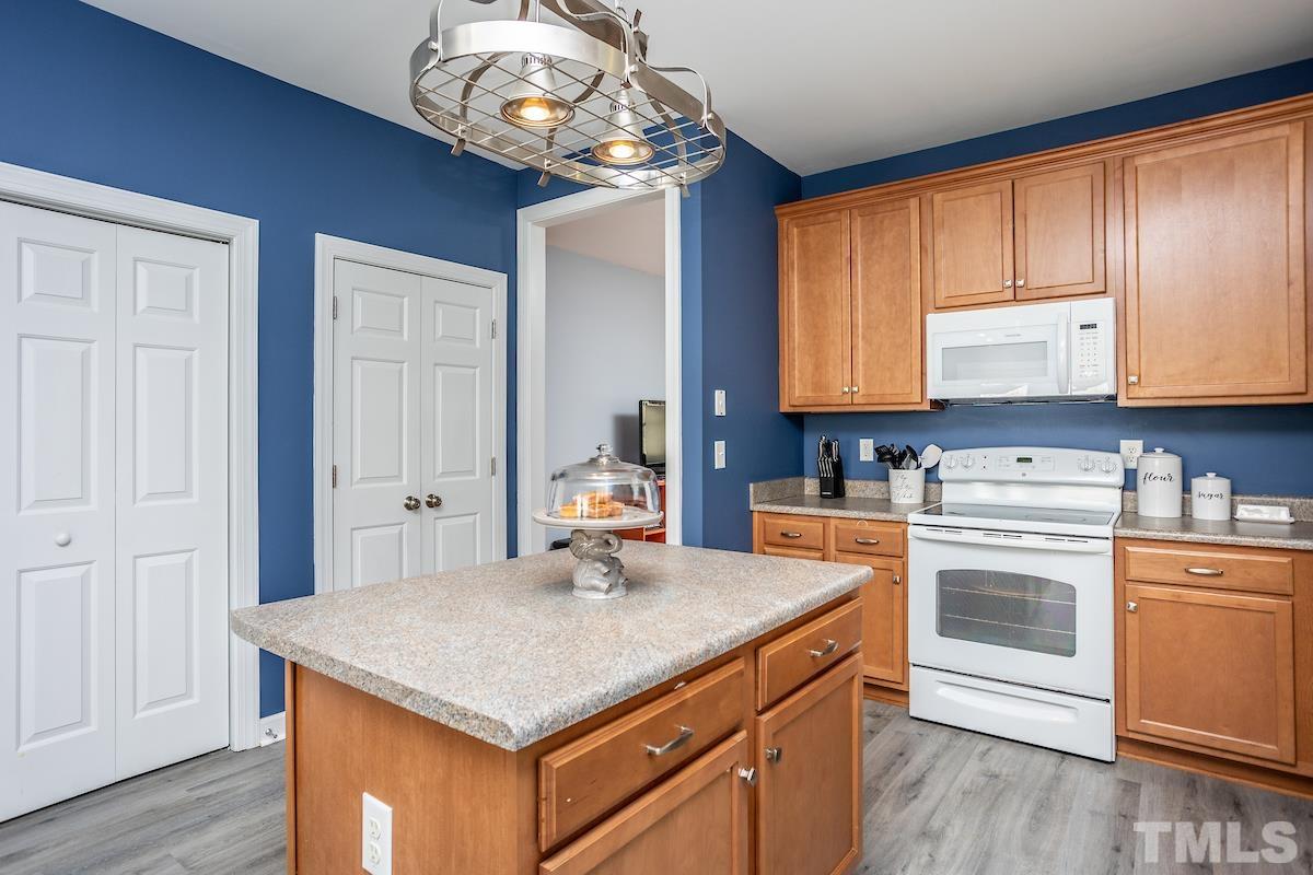 805 East Jones Street Raleigh, NC 27601 - Photo 9 of 24 a kitchen with a stove window and cabinets