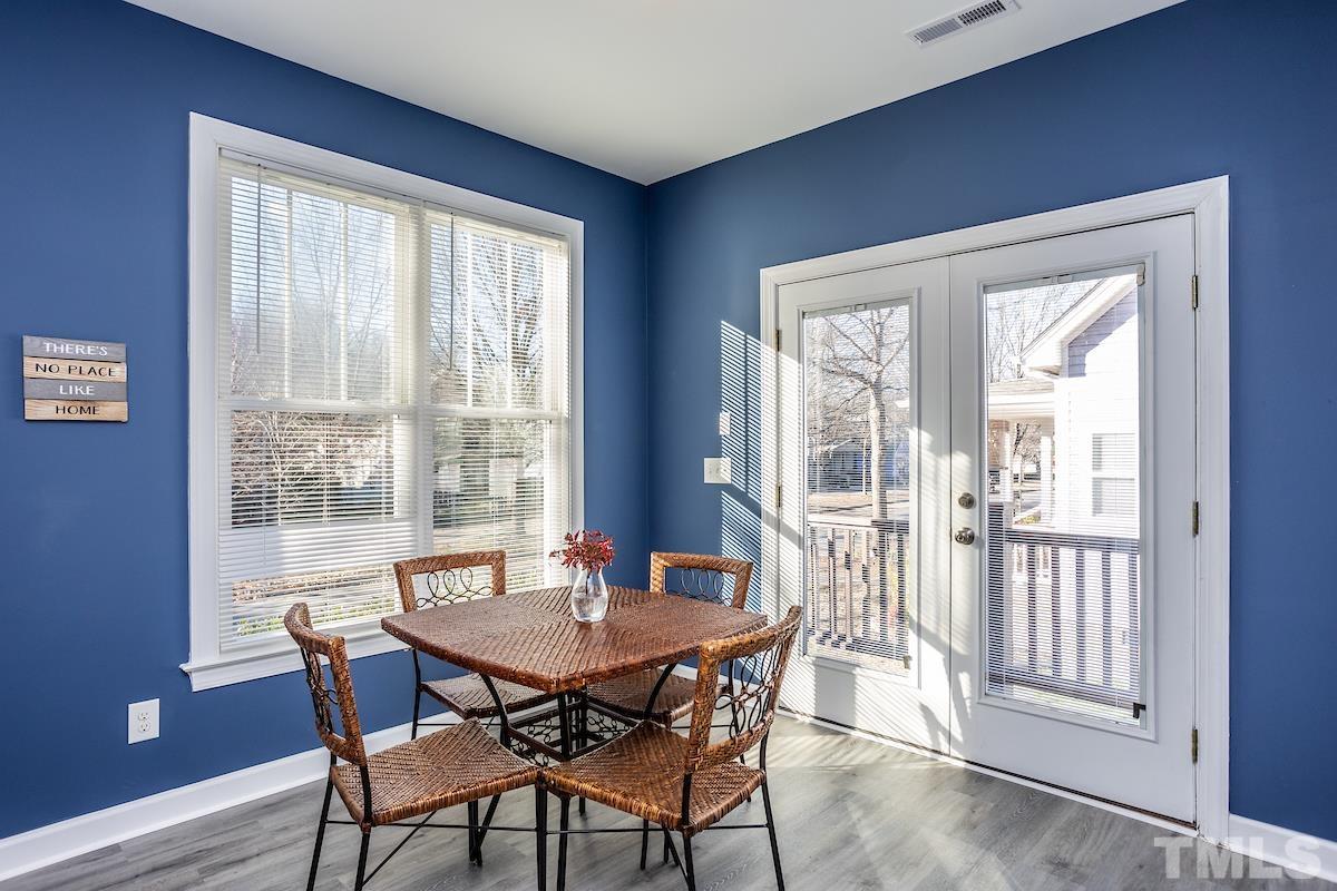 805 East Jones Street Raleigh, NC 27601 - Photo 10 of 24 a view of a dining room with furniture window and wooden floor