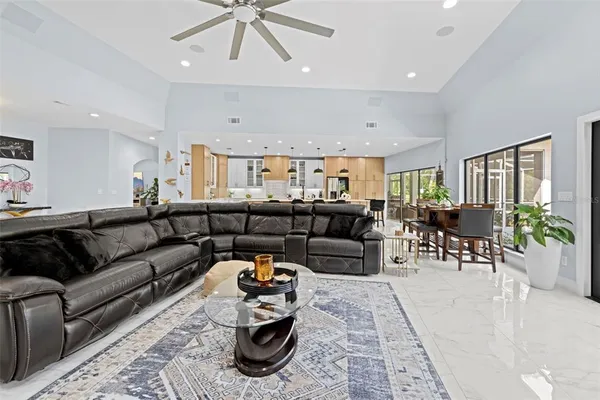 a kitchen with cabinets appliances a sink and a counter top space