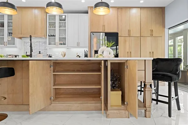 a bathroom with a granite countertop sink a mirror a bathtub and shower