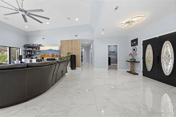a kitchen with stainless steel appliances granite countertop a refrigerator and a stove top oven