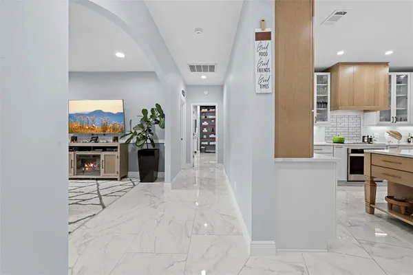 a bedroom with a bed dresser and a window