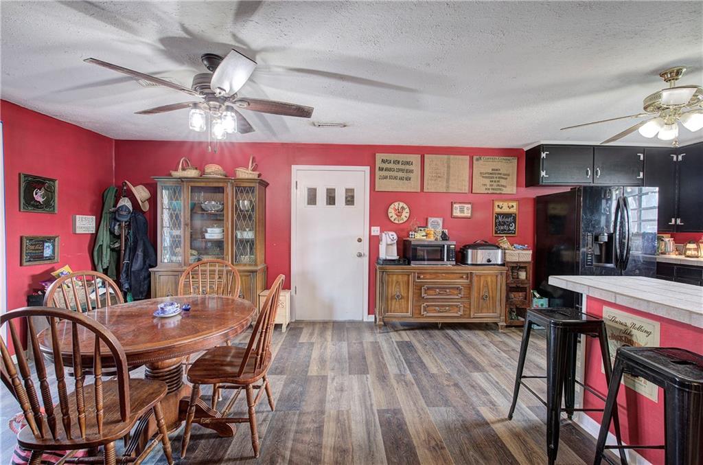 29 Johns Drive Northeast Rome, GA 30165 - Photo 14 of 26 a view of a dining room with furniture and chandelier