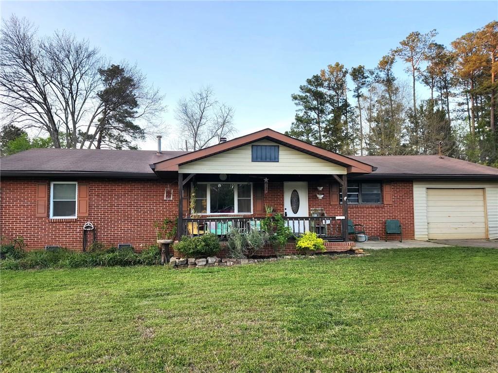 29 Johns Drive Northeast Rome, GA 30165 - Photo 2 of 32 a front view of a house with garden