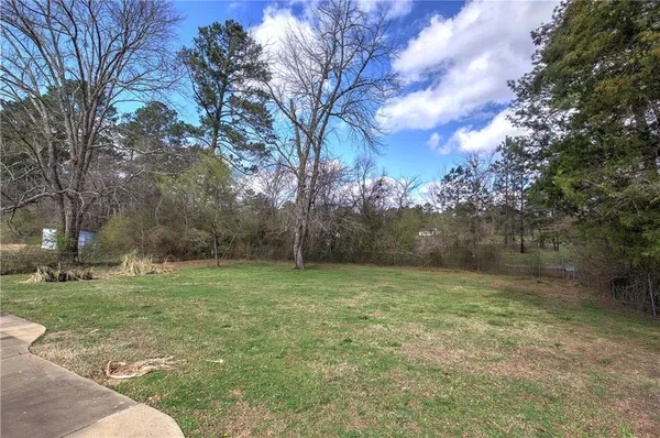 a backyard of a house with lots of green space