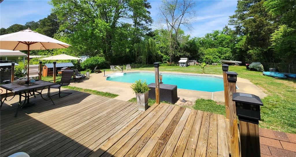29 Johns Drive Northeast Rome, GA 30165 - Photo 31 of 32 a view of a swimming pool with a patio