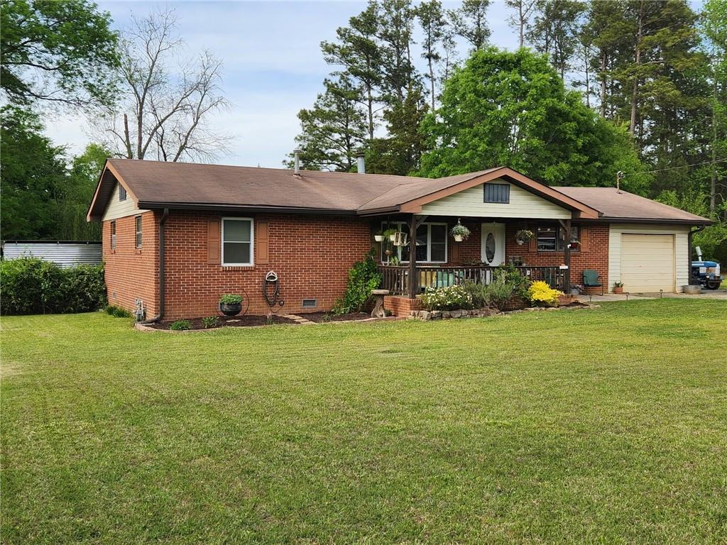29 Johns Drive Northeast Rome, GA 30165 - Photo 4 of 32 a front view of a house with garden