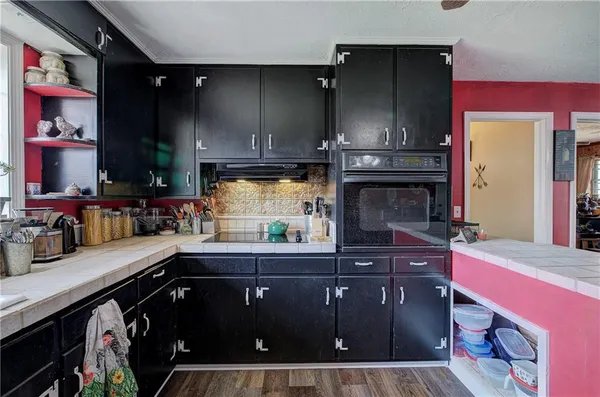 a kitchen with a sink and cabinets