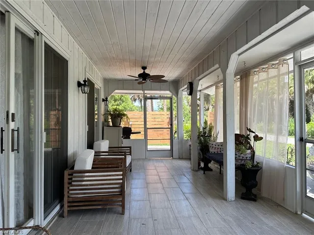 a view of front door with wooden floor and stairs