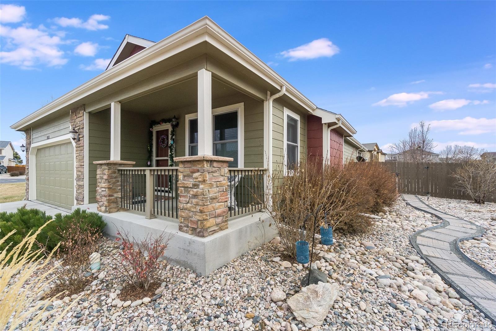 2151 Redhead Drive Johnstown, CO 80534 - Photo 12 of 37 a front view of a house with a yard