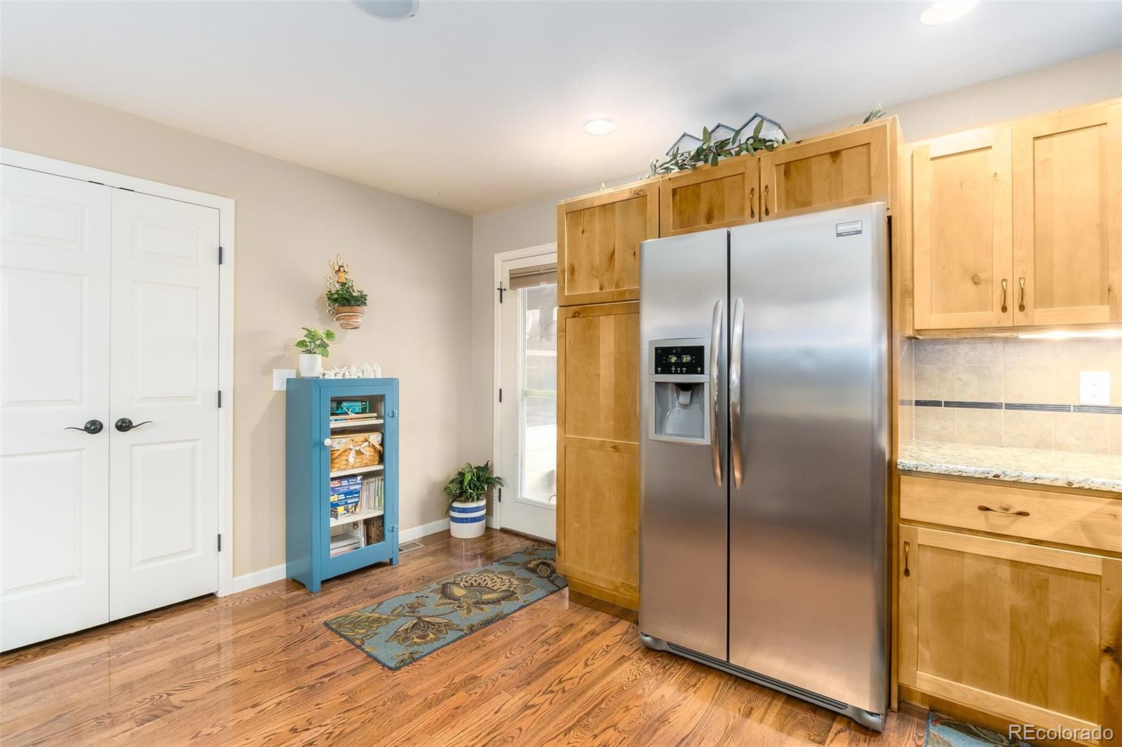 2151 Redhead Drive Johnstown, CO 80534 - Photo 18 of 37 a kitchen with a refrigerator and a refrigerator