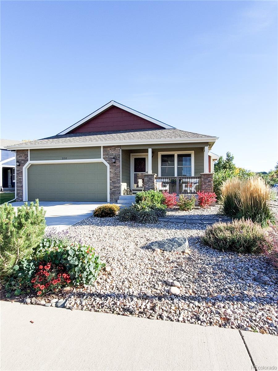 2151 Redhead Drive Johnstown, CO 80534 - Photo 2 of 37 a front view of a house with garden