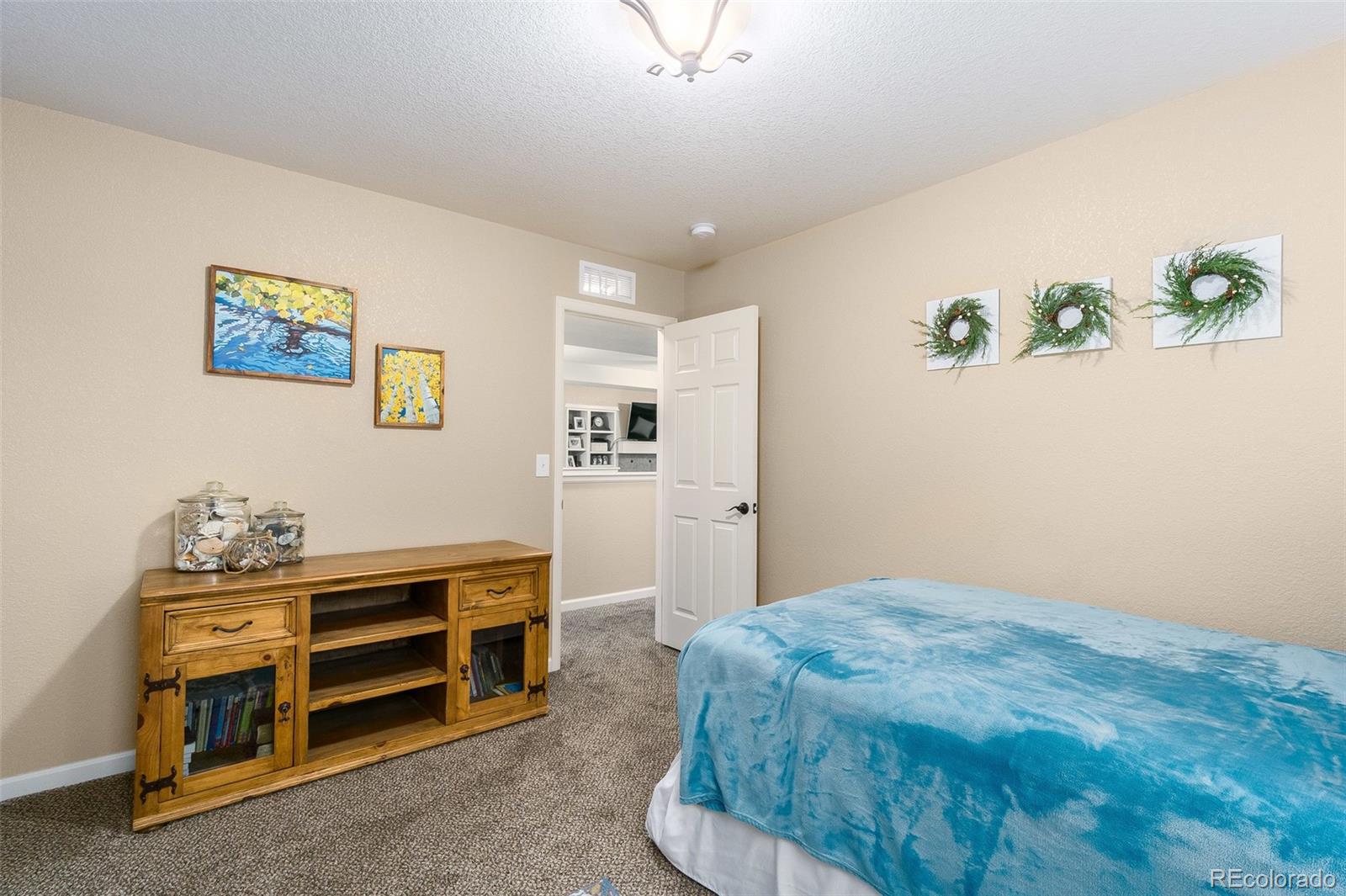 2151 Redhead Drive Johnstown, CO 80534 - Photo 27 of 37 a bedroom with a bed and a window