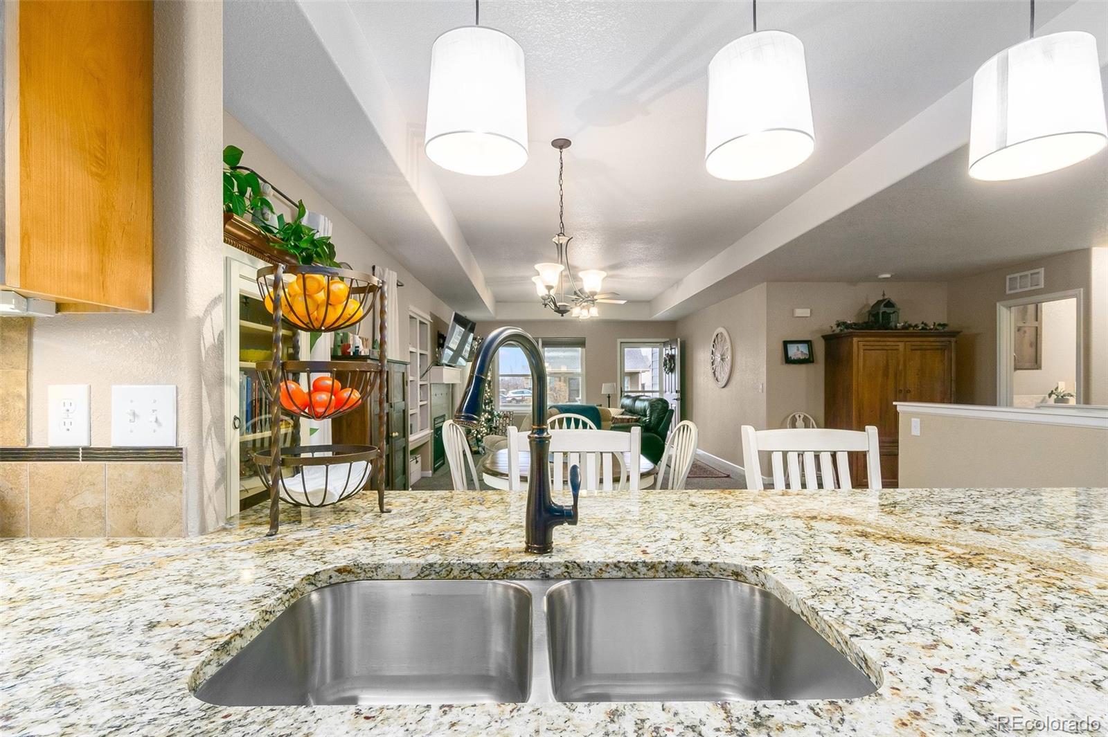 2151 Redhead Drive Johnstown, CO 80534 - Photo 28 of 37 a kitchen with a sink and a wooden floor